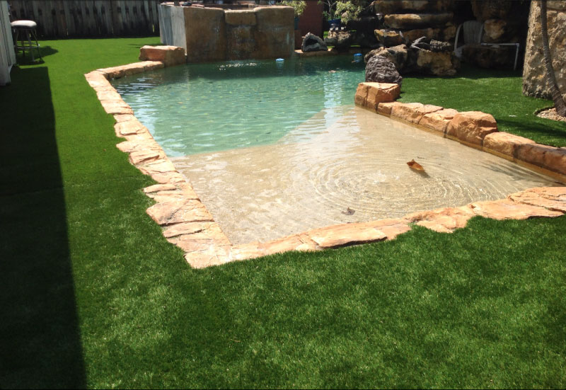 Artificial grass around a pool in surrey