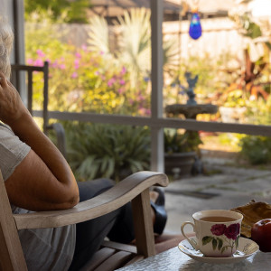 Woman drinking tea and relaxing in garden