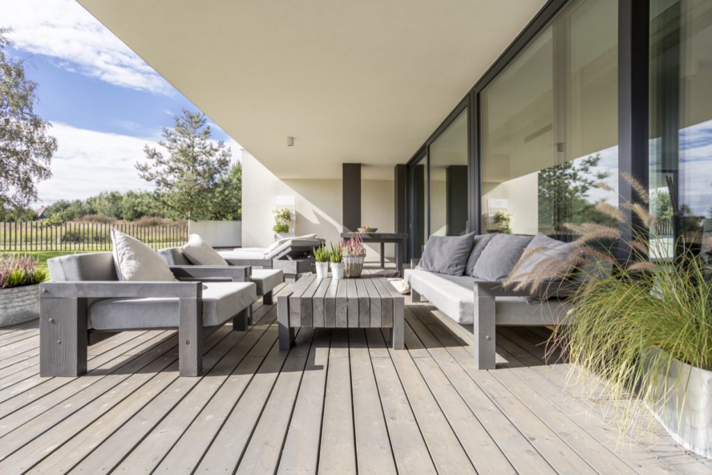 outdoor furniture in modern setting with grey tones