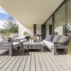 outdoor furniture in modern setting with grey tones