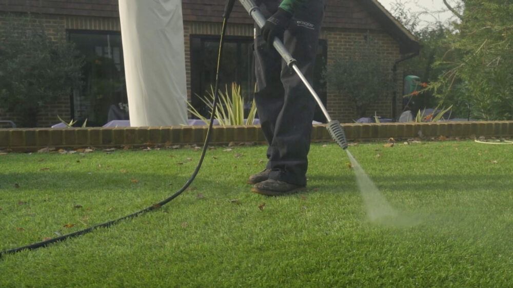 What is the Method for Cleaning Artificial Grass Surfaces of Snow and Debris