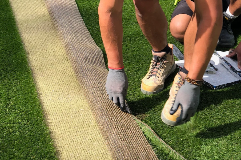 Easigrass Team Member Cutting Artificial Grass During Installation Processs